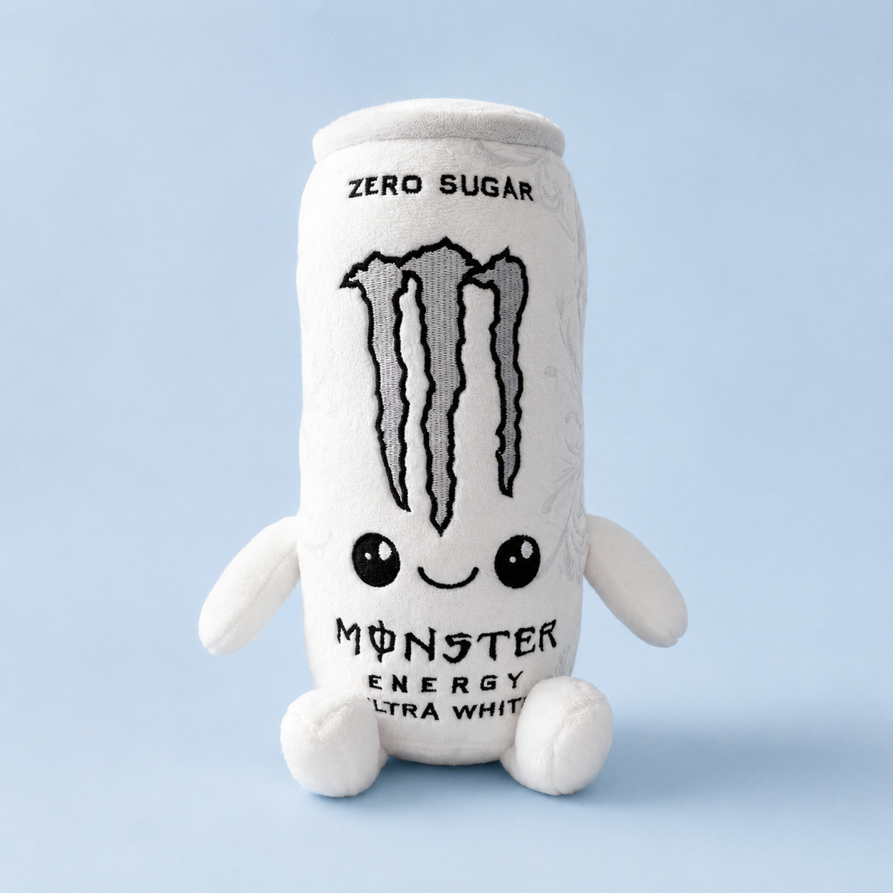 White can plush with a smiling embroidered face on a soft blue background